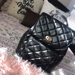Quilted flap-top backpack